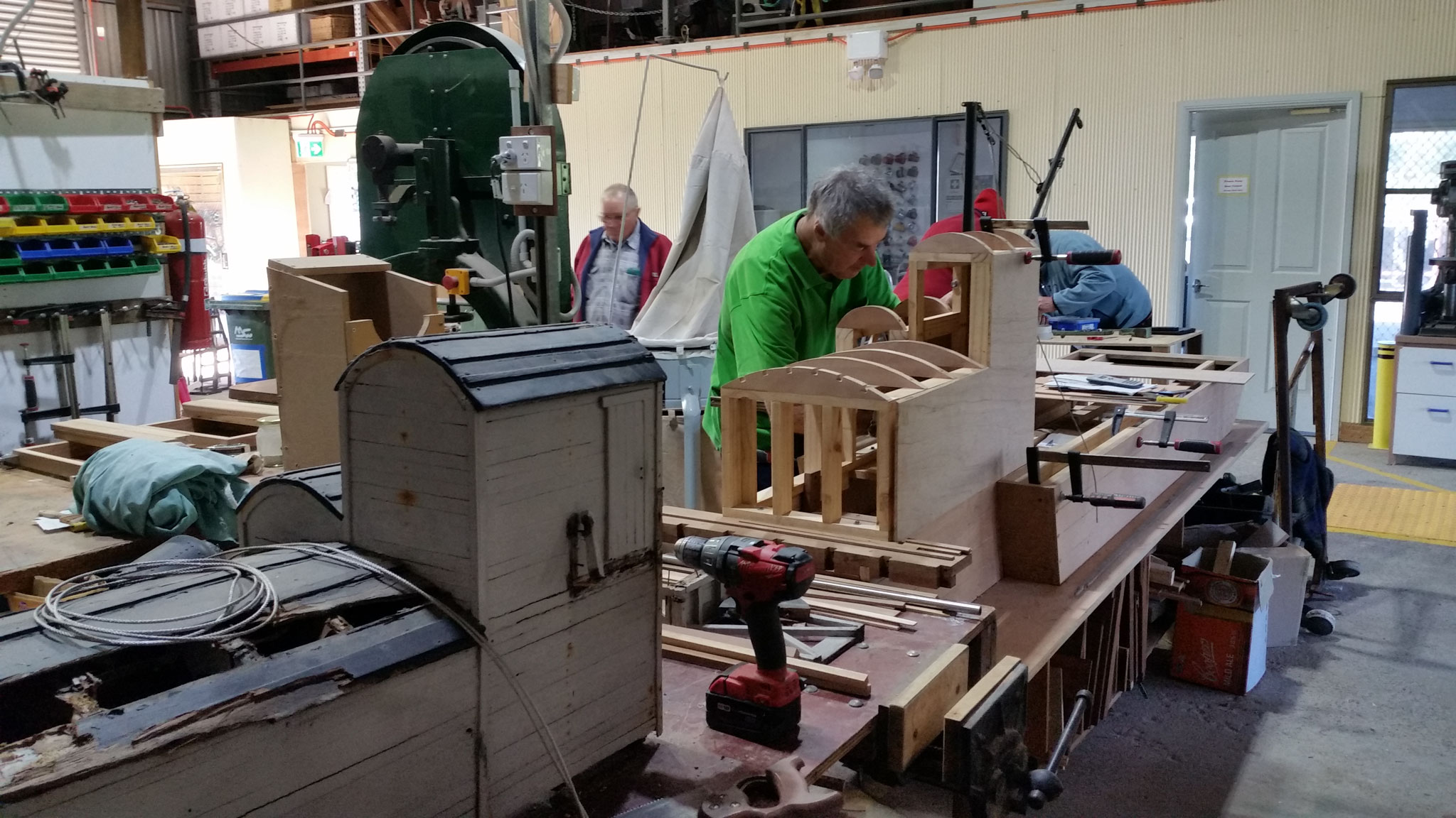Photo showing a shed member restoring a historic wooden drogher