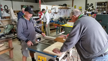 Shed members working together in the workshop